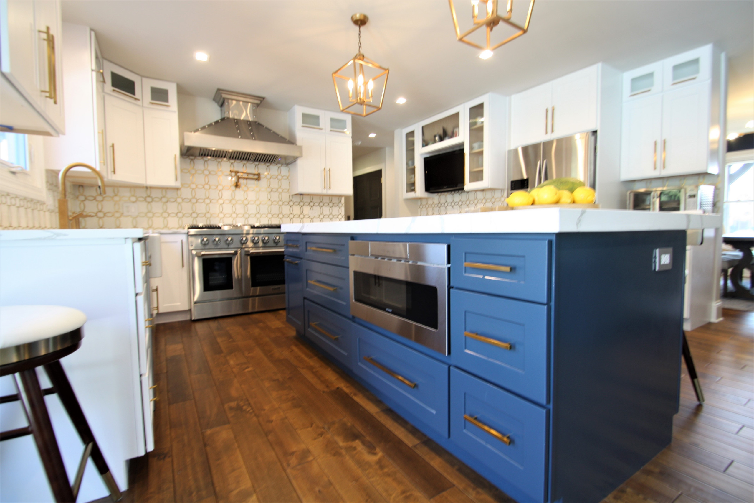 Modern kitchen design and remodel. Shaker style cabinets in white and blue.