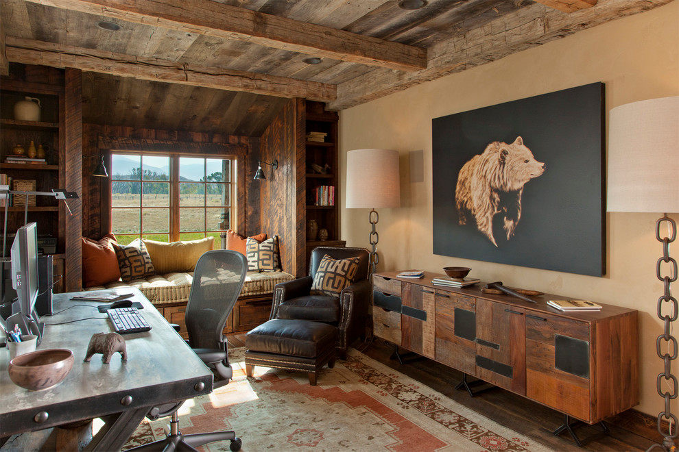 Large country home office in Other with beige walls, dark hardwood floors, a freestanding desk and no fireplace.