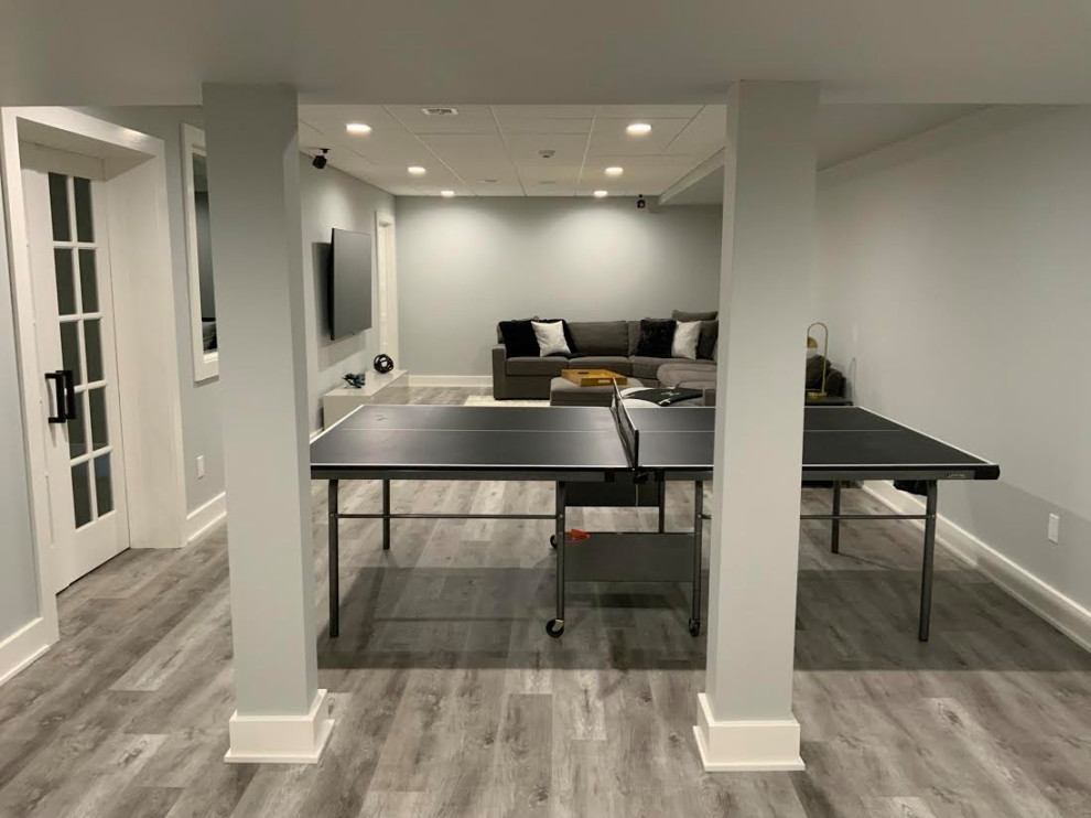 A Transitional Fun Family Basement with Bathroom, Gym, Movie Room and Gaming Ar