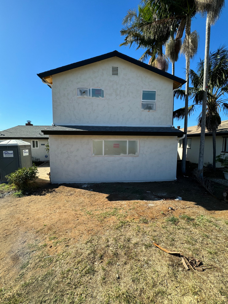 Different sized windows on front of home can I add anything to help?