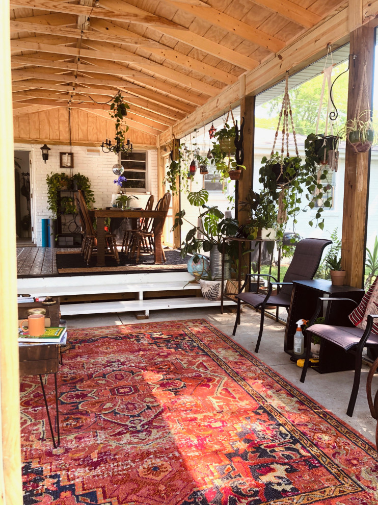 Inspiration for a medium sized rustic back patio in Nashville with a roof extension.