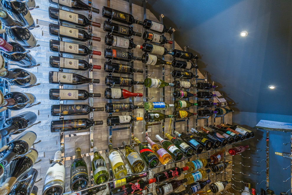 Photo of a large beach style wine cellar in Miami.