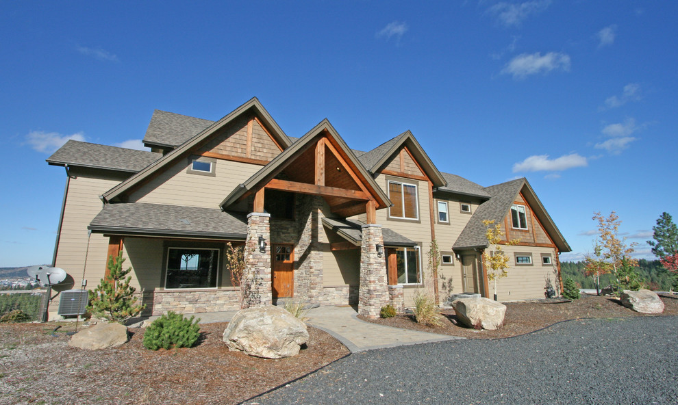 Large mountain style brown two-story mixed siding gable roof photo in Seattle