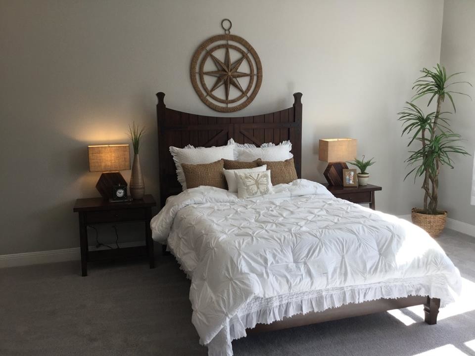 Photo of a small eclectic guest bedroom in Portland with beige walls, carpet, no fireplace and beige floor.