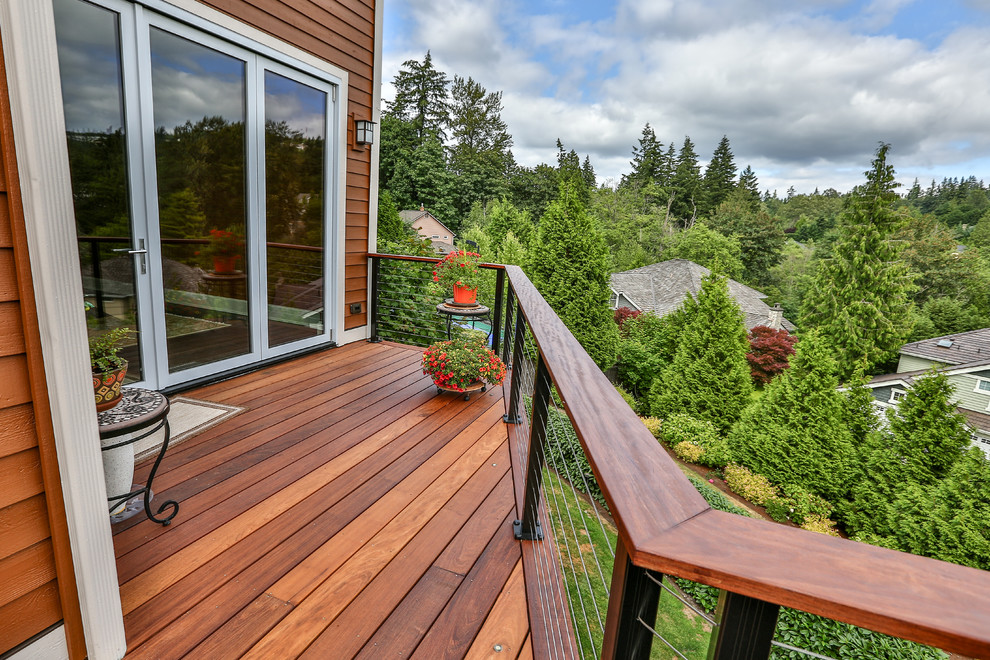 This is an example of a large modern backyard deck in Seattle with no cover.
