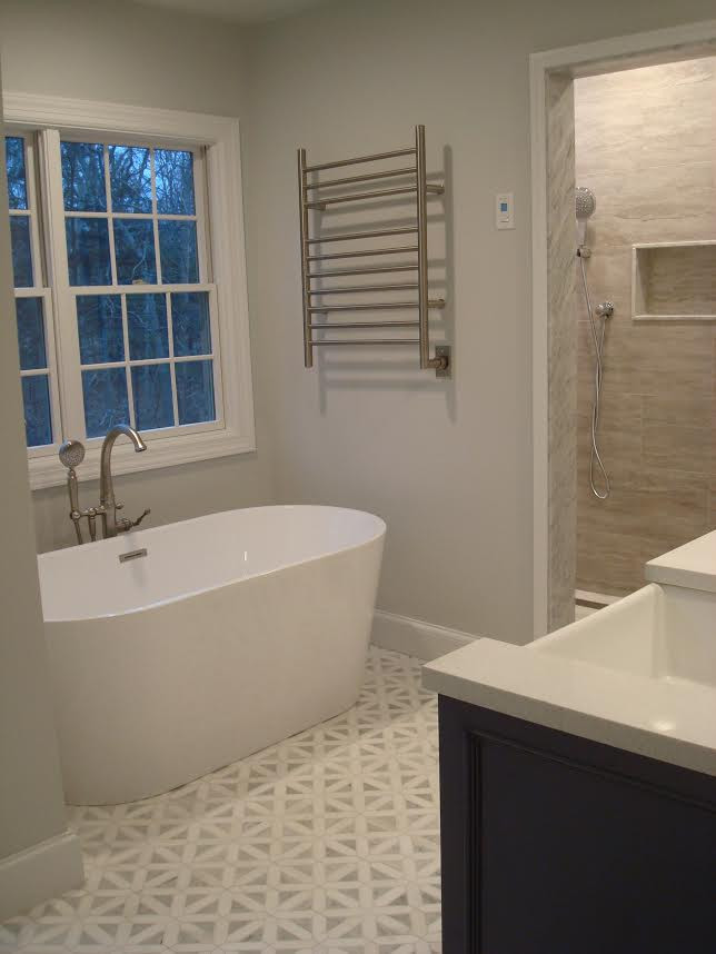 Example of a mid-sized transitional master beige tile multicolored floor and double-sink freestanding bathtub design in New York with dark wood cabinets, gray walls, an undermount sink, quartz countertops, white countertops and a built-in vanity