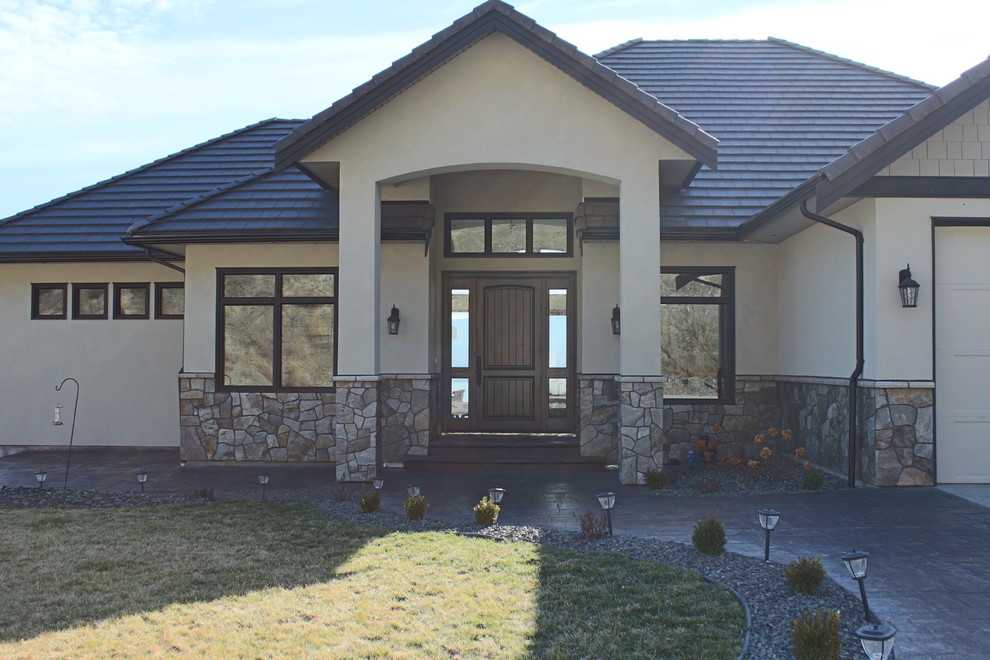 Large mountain style front door photo in Vancouver with a dark wood front door