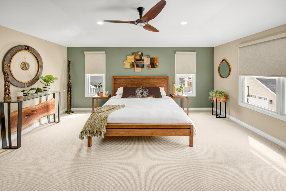 Design ideas for a mid-sized transitional master bedroom in Detroit with beige walls, carpet and beige floor.