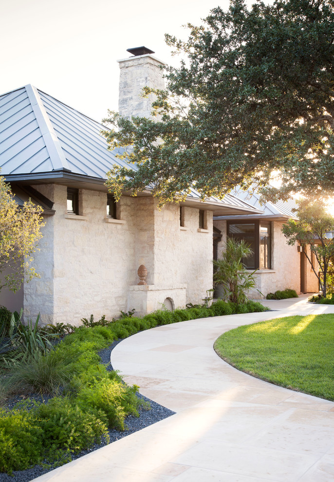 Inspiration for a transitional garden in Austin with a garden path.