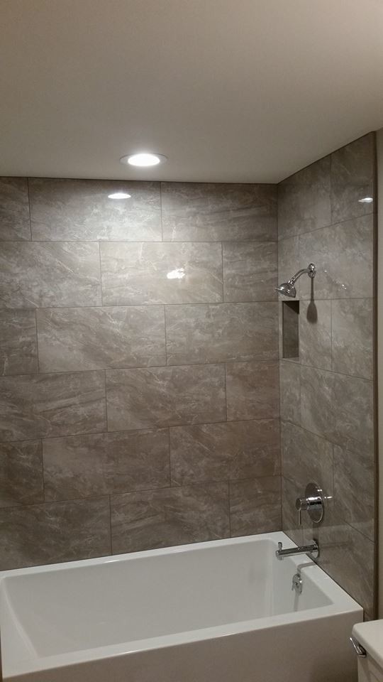 Photo of a modern bathroom in Seattle with porcelain tile.
