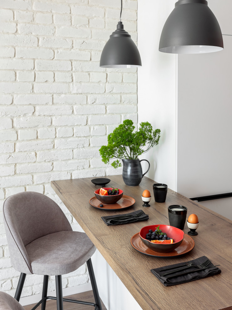 Photo of a small scandinavian l-shaped eat-in kitchen in Saint Petersburg with a single-bowl sink, flat-panel cabinets, pink cabinets, wood benchtops, multi-coloured splashback, porcelain splashback, stainless steel appliances, medium hardwood floors, brown floor and brown benchtop.