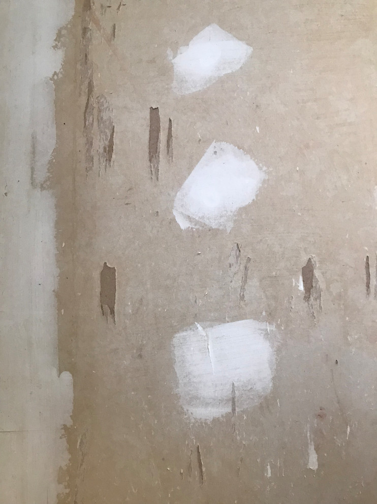 How to clean wallpaper glue off unfinished Sheetrock?