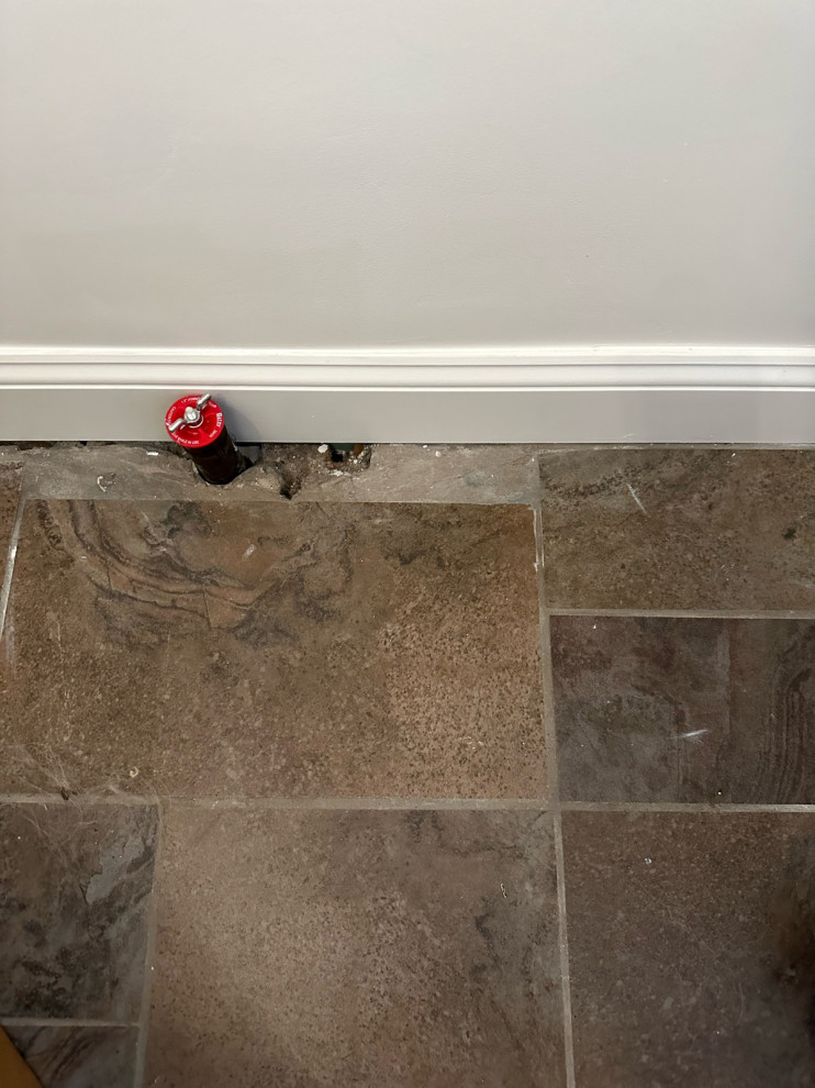 How to fill gaps in tile around a pipe?