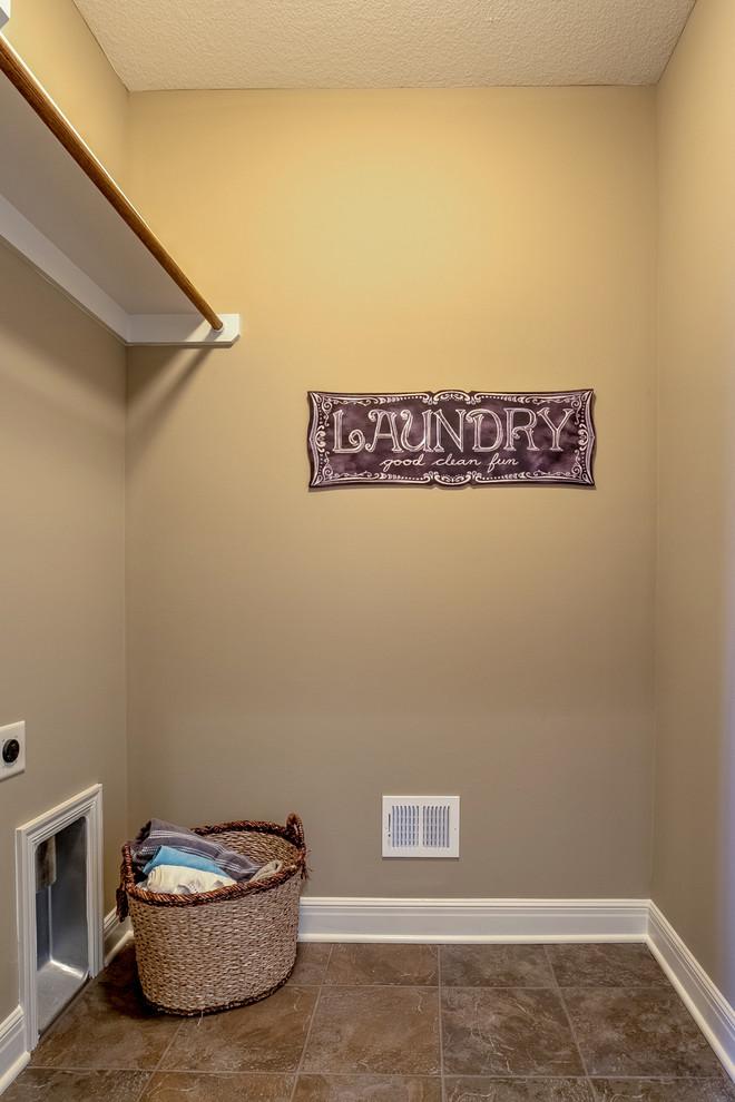 Mid-sized arts and crafts galley dedicated laundry room in Kansas City.