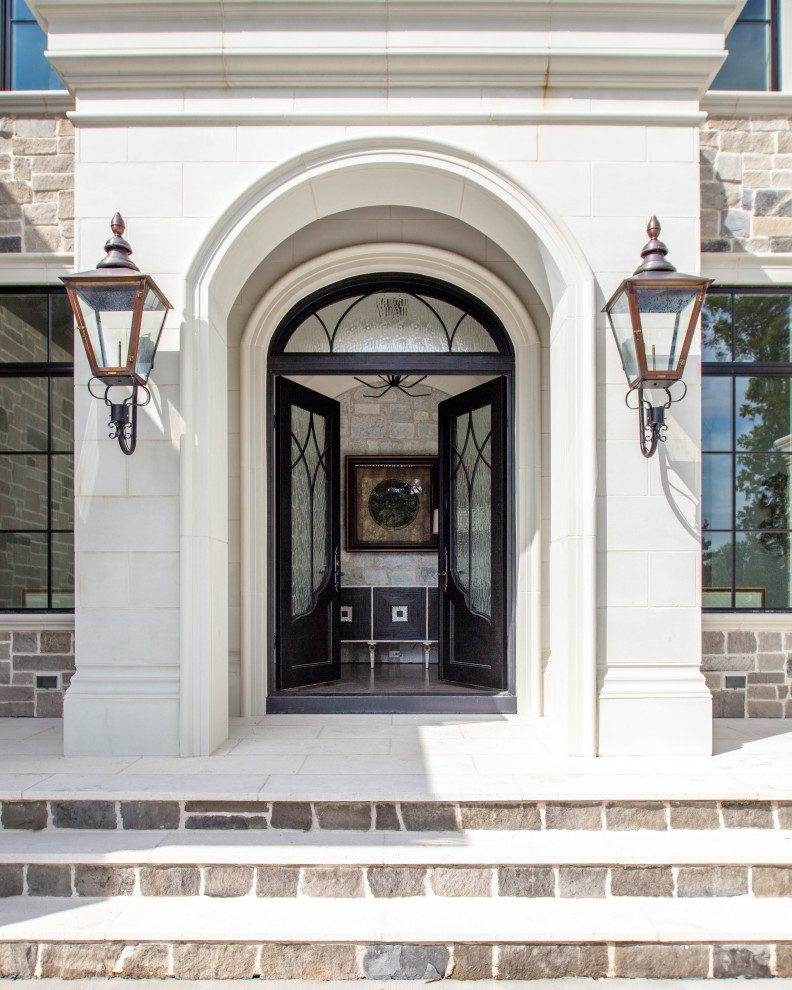 Design ideas for a mediterranean entryway in Charlotte with a double front door, a glass front door and white floor.