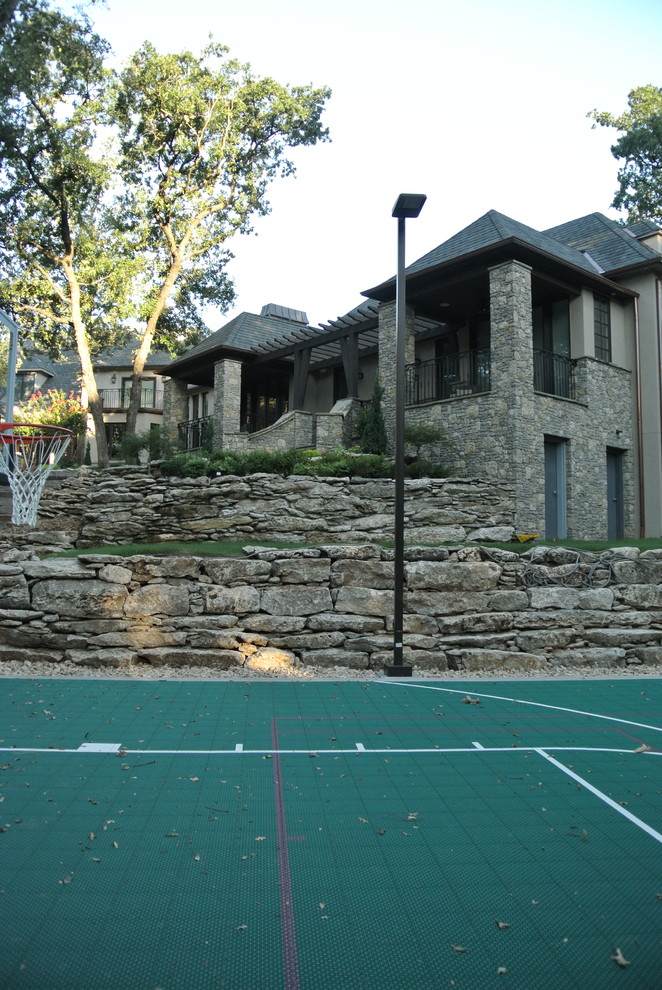 Example of a mid-sized mountain style beige one-story mixed siding gable roof design with a shingle roof