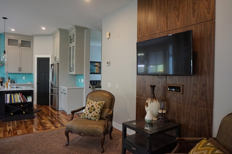 Inspiration for a mid-sized transitional l-shaped medium tone wood floor and brown floor kitchen remodel with an undermount sink, shaker cabinets, gray cabinets, quartz countertops, blue backsplash, ceramic backsplash, stainless steel appliances and an island