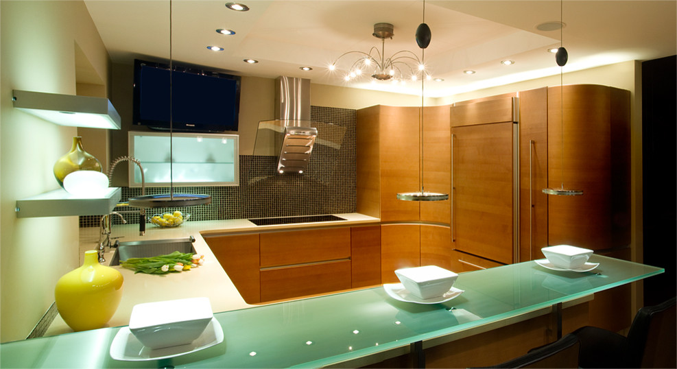 Photo of a contemporary u-shaped eat-in kitchen in Calgary with a single-bowl sink, flat-panel cabinets, light wood cabinets, quartzite benchtops, brown splashback and panelled appliances.