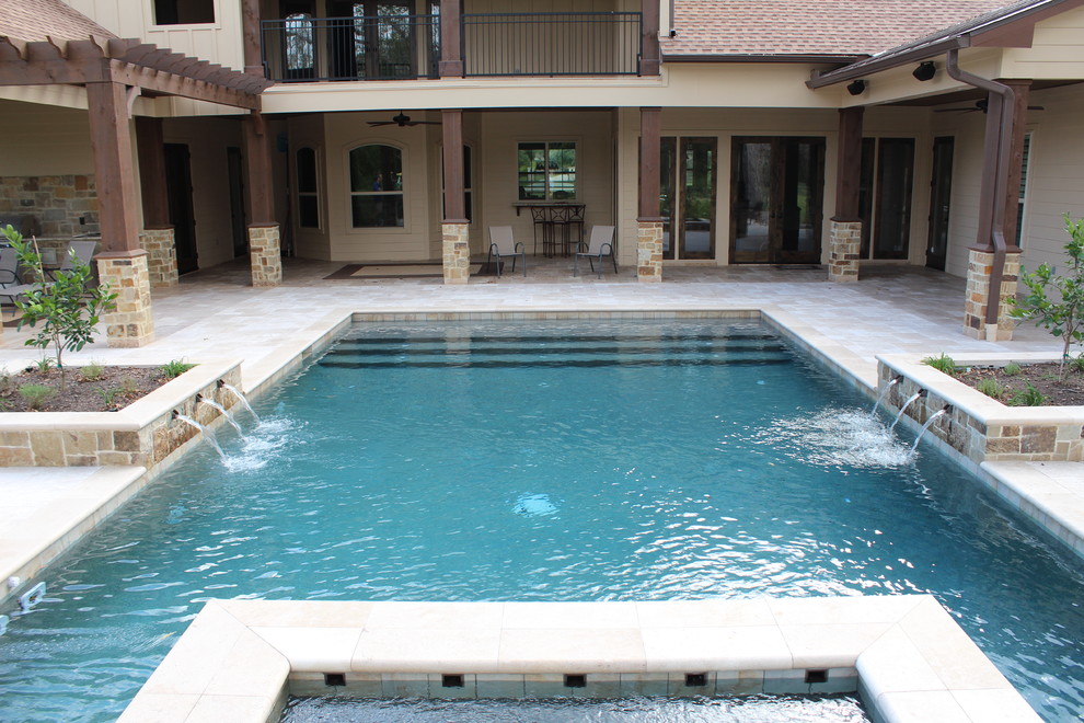 Hot tub - large transitional backyard stone and rectangular lap hot tub idea in Houston