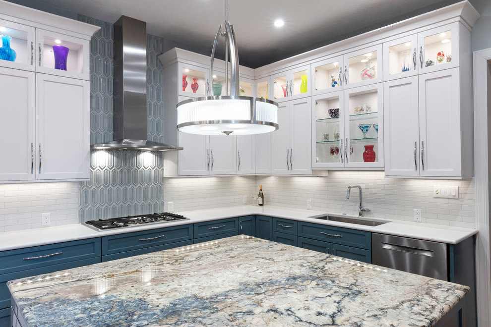 Inspiration for a transitional kitchen remodel with white backsplash and stainless steel appliances