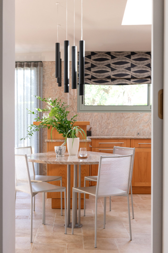 Eat-in kitchen - large contemporary l-shaped ceramic tile and beige floor eat-in kitchen idea in Lyon with an undermount sink, raised-panel cabinets, light wood cabinets, granite countertops, pink backsplash, granite backsplash, paneled appliances, a peninsula and pink countertops