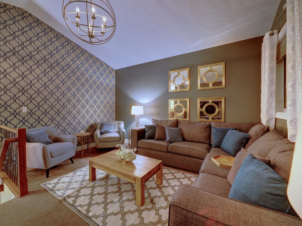 Example of a mid-sized transitional home design design in Edmonton