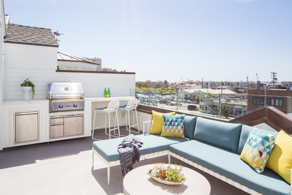 This is an example of a beach style rooftop and rooftop deck in Orange County with no cover.