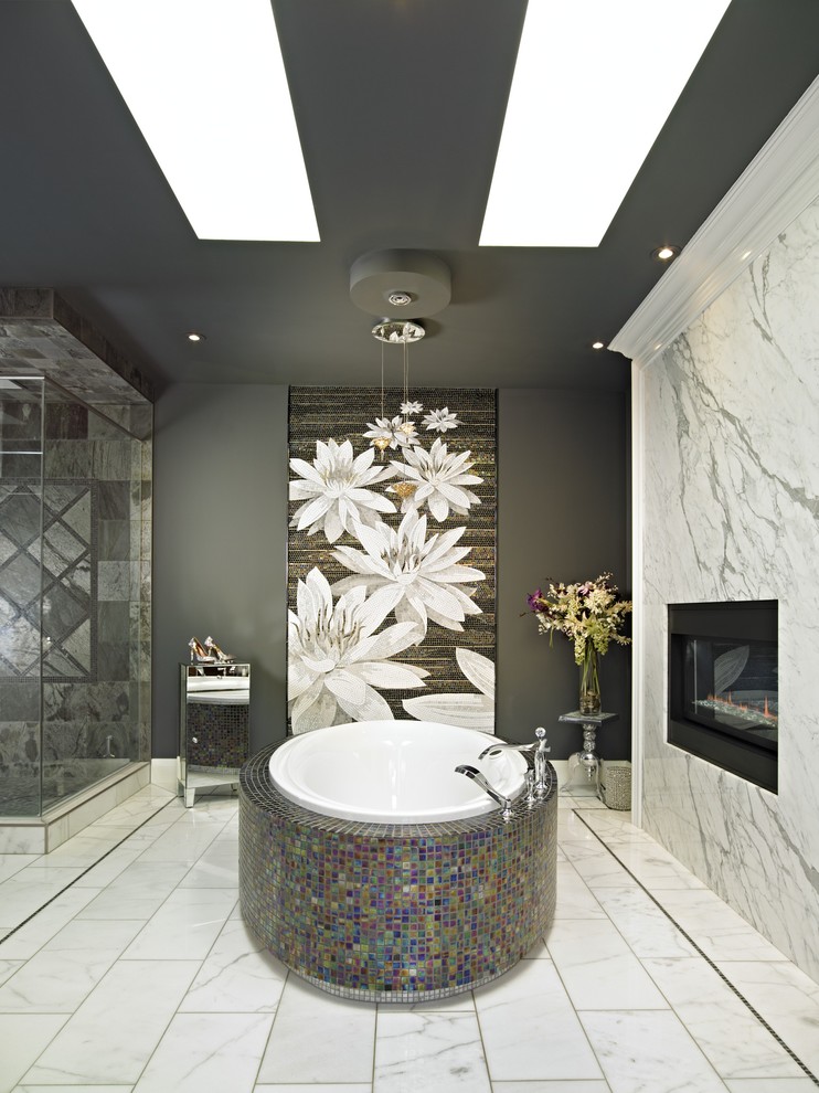 Large contemporary master bathroom in Calgary with mosaic tile, a freestanding tub, multi-coloured tile, grey walls and marble floors.