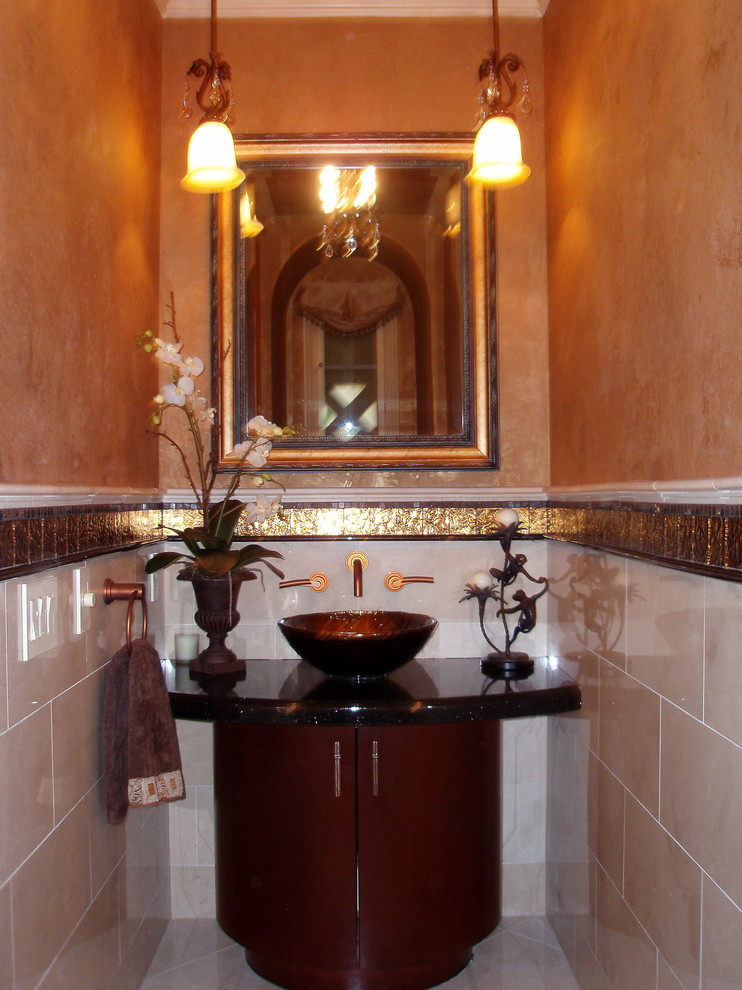 This is an example of a mediterranean powder room in Orange County.