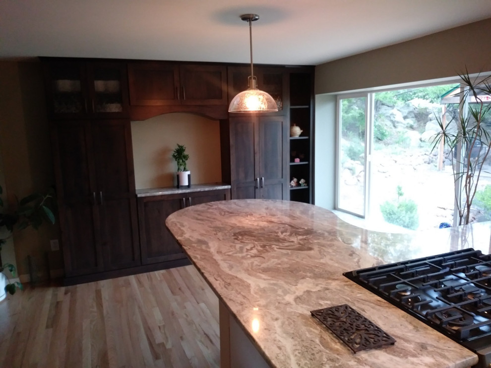 Large transitional kitchen photo with dark wood cabinets and a peninsula