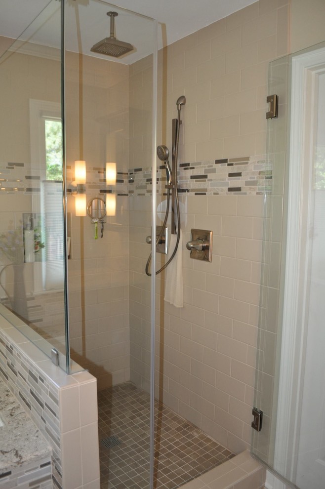 Photo of a mid-sized contemporary master bathroom in Atlanta with shaker cabinets, dark wood cabinets, a drop-in tub, a corner shower, a two-piece toilet, beige tile, black tile, brown tile, matchstick tile, beige walls, slate floors, an undermount sink and granite benchtops.