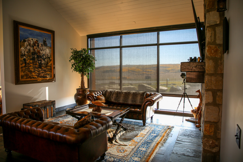 Example of a mountain style home design design in Calgary