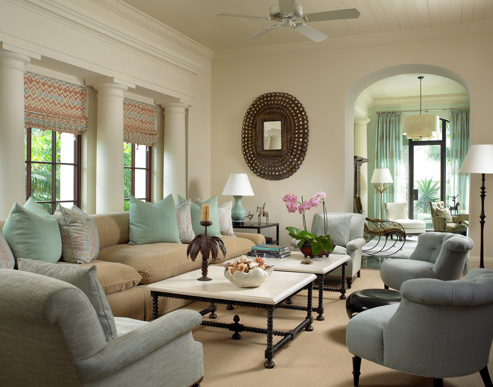 Example of an island style enclosed living room design in New York with beige walls