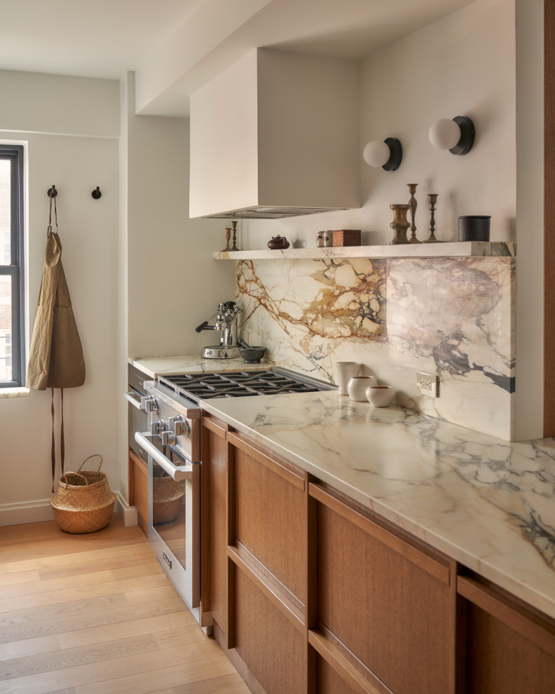 Small danish galley light wood floor, brown floor and exposed beam open concept kitchen photo in New York with an undermount sink, flat-panel cabinets, medium tone wood cabinets, marble countertops, multicolored backsplash, marble backsplash, paneled appliances, a peninsula and multicolored countertops
