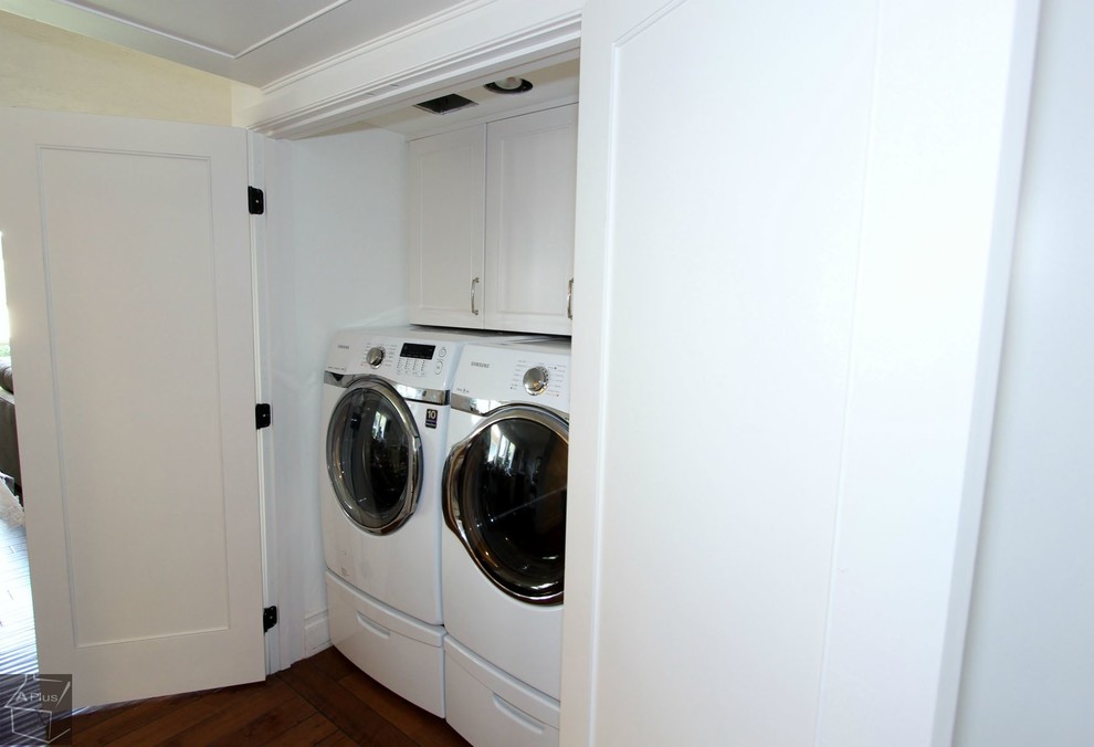 Design ideas for a mid-sized traditional laundry cupboard in Orange County with recessed-panel cabinets and white cabinets.