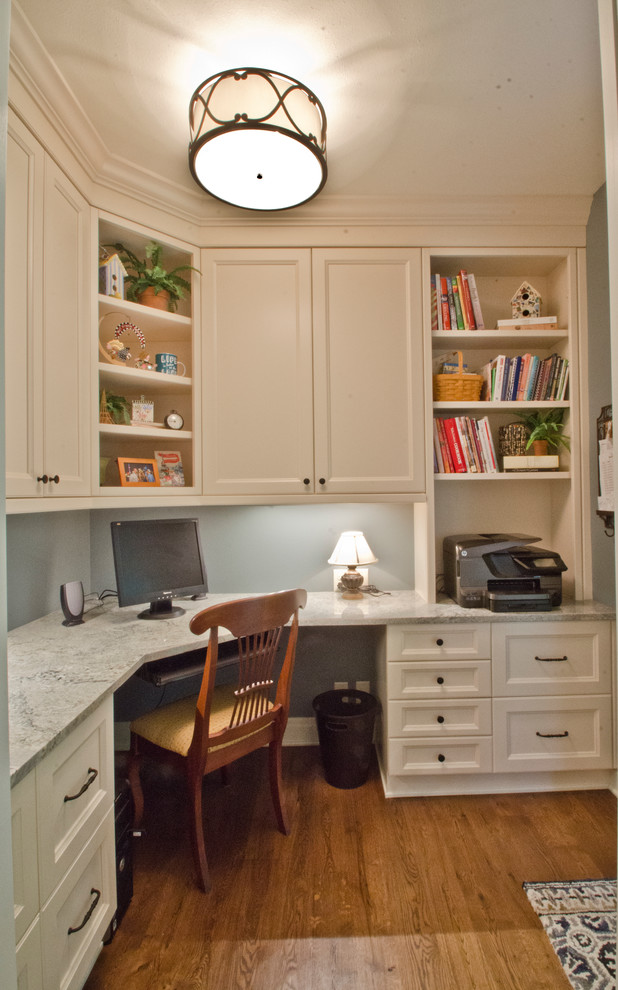 Design ideas for a small traditional home office in Milwaukee with blue walls, medium hardwood floors and a built-in desk.