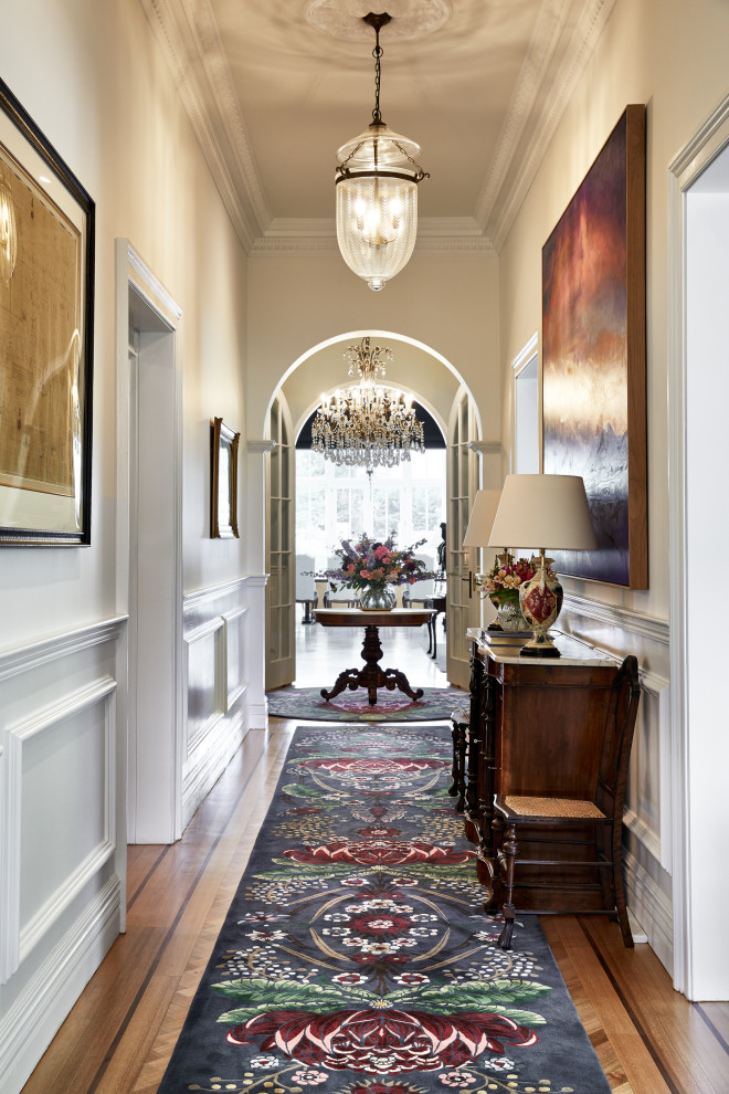 Inspiration for a large transitional hallway in Other with white walls, carpet and multi-coloured floor.