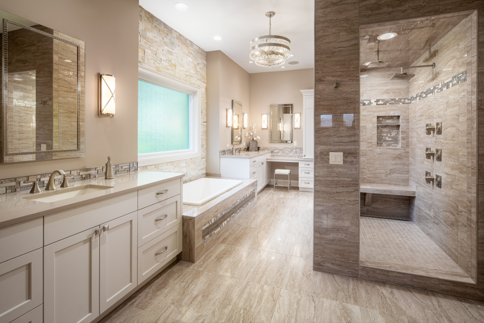 Design ideas for a large transitional master bathroom in Omaha with recessed-panel cabinets, white cabinets, a drop-in tub, an open shower, a two-piece toilet, beige tile, porcelain tile, beige walls, porcelain floors, an undermount sink, engineered quartz benchtops, beige floor, an open shower and beige benchtops.