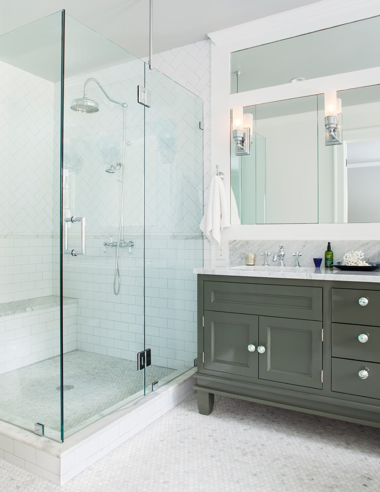 This is an example of a traditional bathroom in Atlanta with grey cabinets, a corner shower, white tile, subway tile and recessed-panel cabinets.