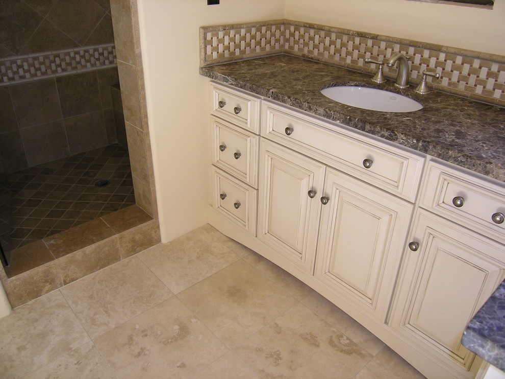 Example of a transitional multicolored tile bathroom design in Phoenix with raised-panel cabinets, white cabinets and granite countertops
