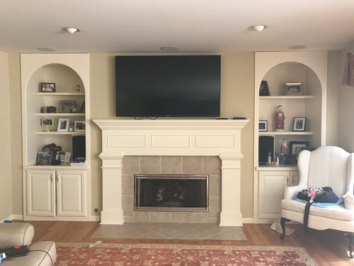 TV over fireplace too high! The previous owners of our house set up their tv above their fireplace and had a sound system built in around it so naturally we placed our tv there as well. We started to notice the tv was too high and our neck was starting to hurt. Recently we just swit