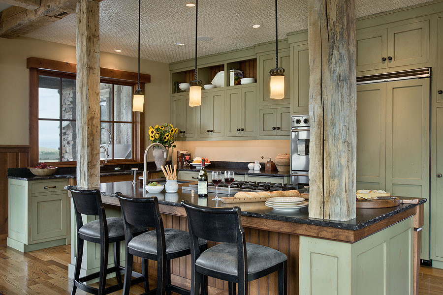 Inspiration for a country l-shaped eat-in kitchen in Other with an undermount sink, green cabinets, granite benchtops, with island, black splashback, stone slab splashback, stainless steel appliances, plywood floors, brown floor and black benchtop.