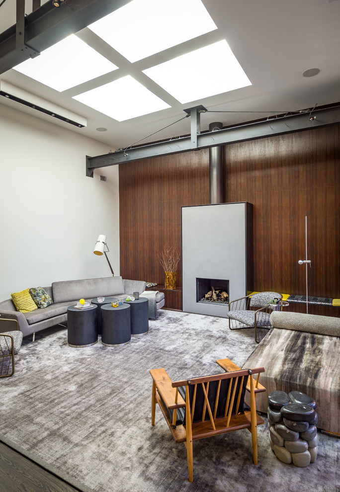 Photo of a contemporary living room in Chicago with white walls, dark hardwood floors and brown floor.