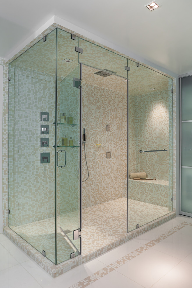 Contemporary master bathroom in Miami with flat-panel cabinets, medium wood cabinets, a corner shower, a one-piece toilet, beige tile, mosaic tile, multi-coloured walls, a vessel sink and solid surface benchtops.