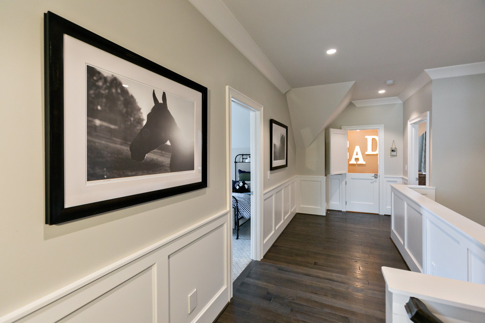 Photo of a mid-sized transitional hallway in Birmingham with grey walls and dark hardwood floors.
