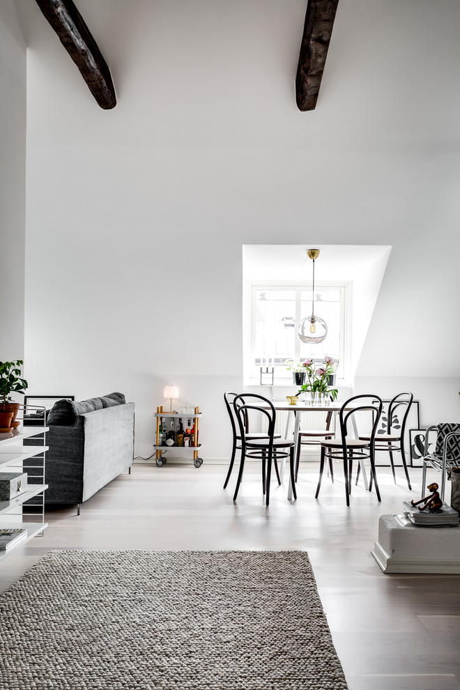 Design ideas for a scandinavian dining room in Stockholm with white walls.