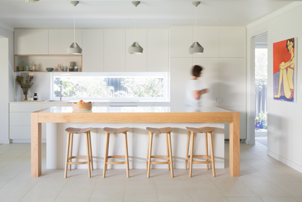 Photo of a contemporary kitchen in Perth with flat-panel cabinets, white cabinets and with island.