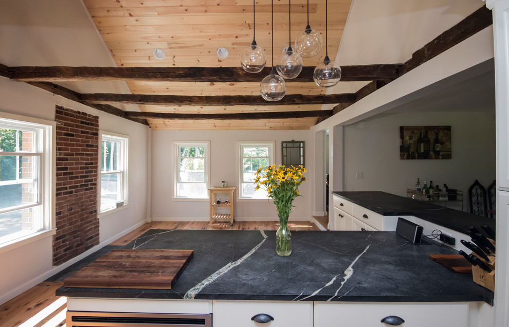 Example of a transitional home design design in Boston