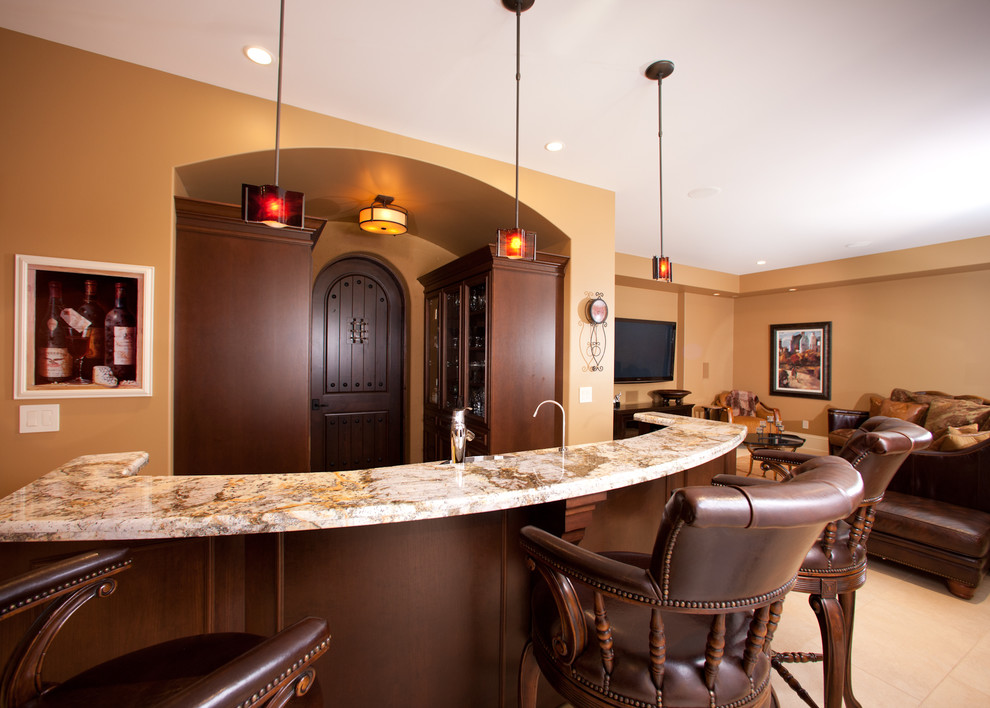 Example of a mid-sized mountain style single-wall porcelain tile and beige floor seated home bar design with dark wood cabinets and granite countertops