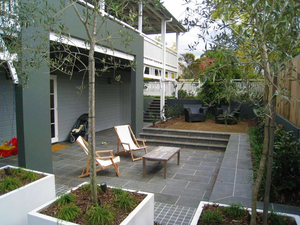 This is an example of a contemporary patio in Brisbane.